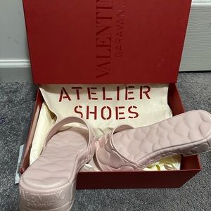 Valentino slides size 38 . Worn once. Comes with box and dust bag.